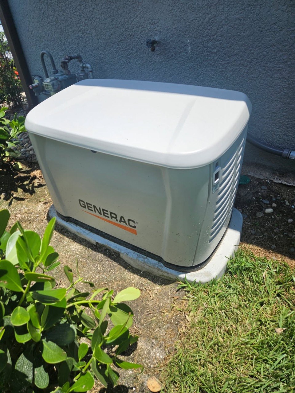 Whole-home Generac standby generator installed outside a residential property
