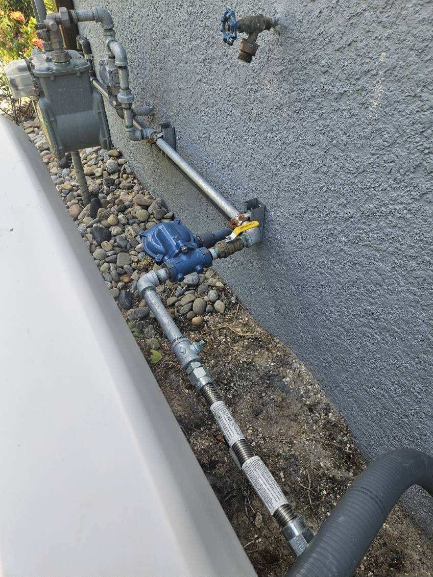 Gas line preparation and regulator connection for a standby generator